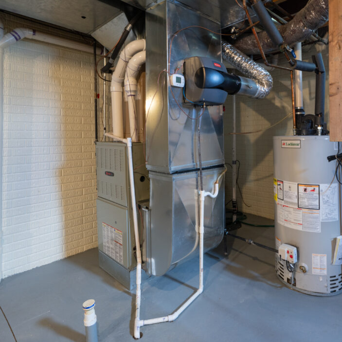 home has been updated with a new residential furnace and hot water tank installed in the basement